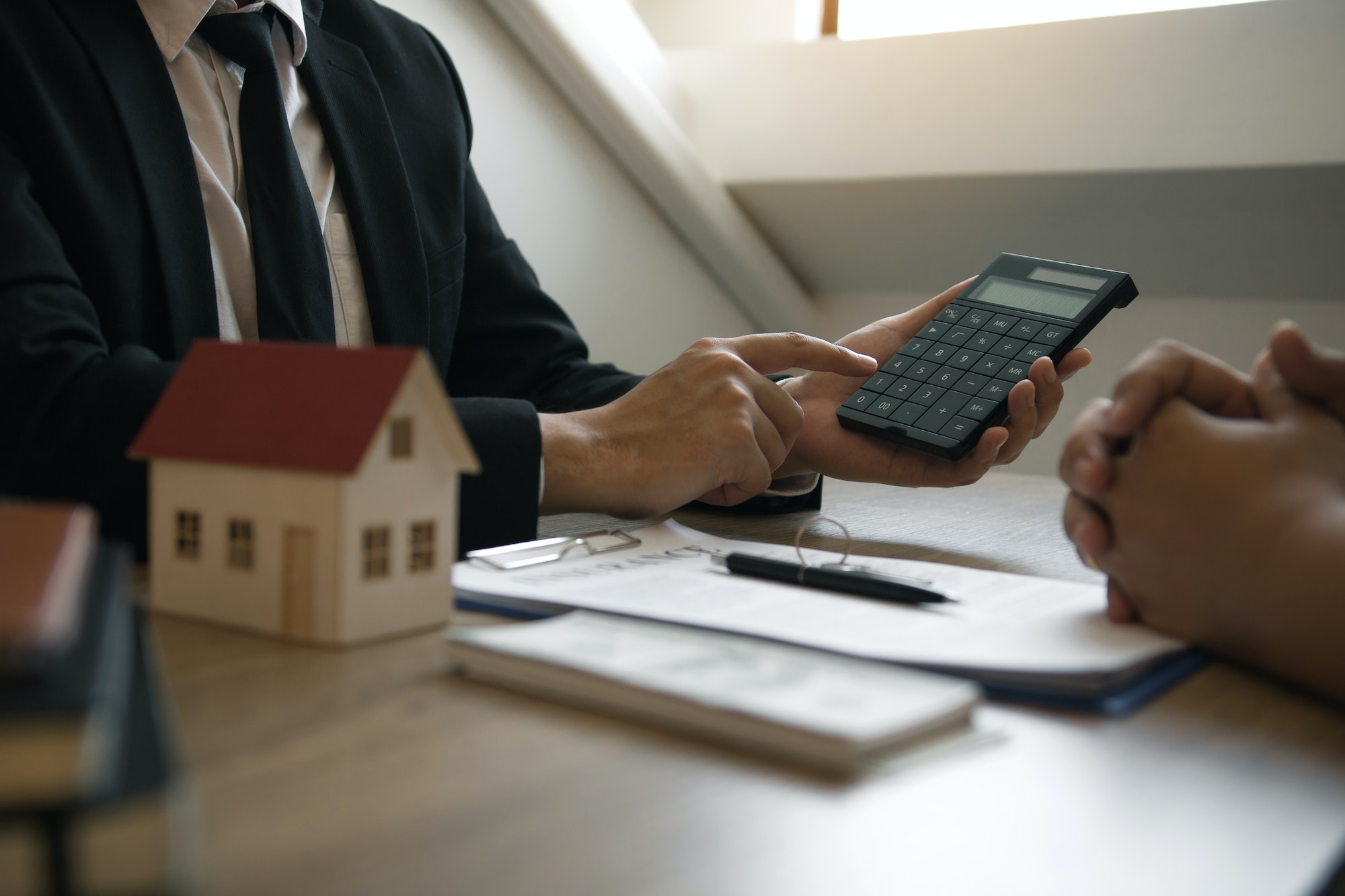 Agents are calculating the loan payment rate or the amount of insurance