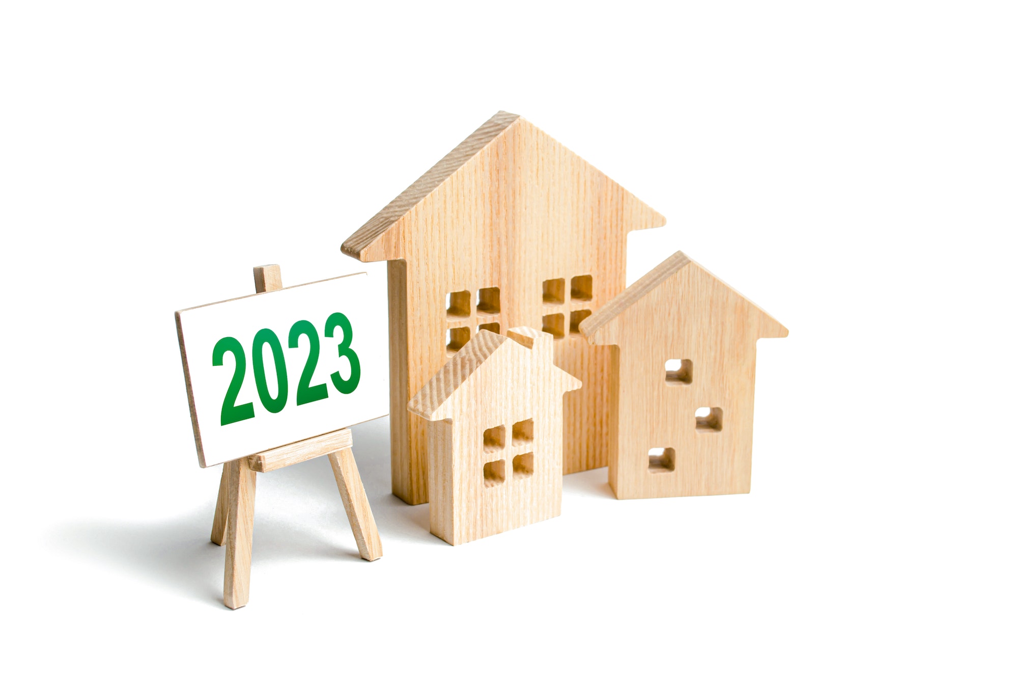 Houses and 2023 sign. Mortgage loan rates.